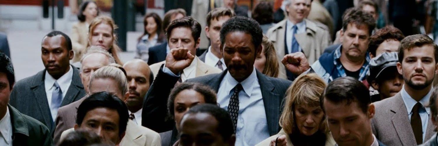 Chris Gardner walking through a crowd after landing the job that changed his family's life